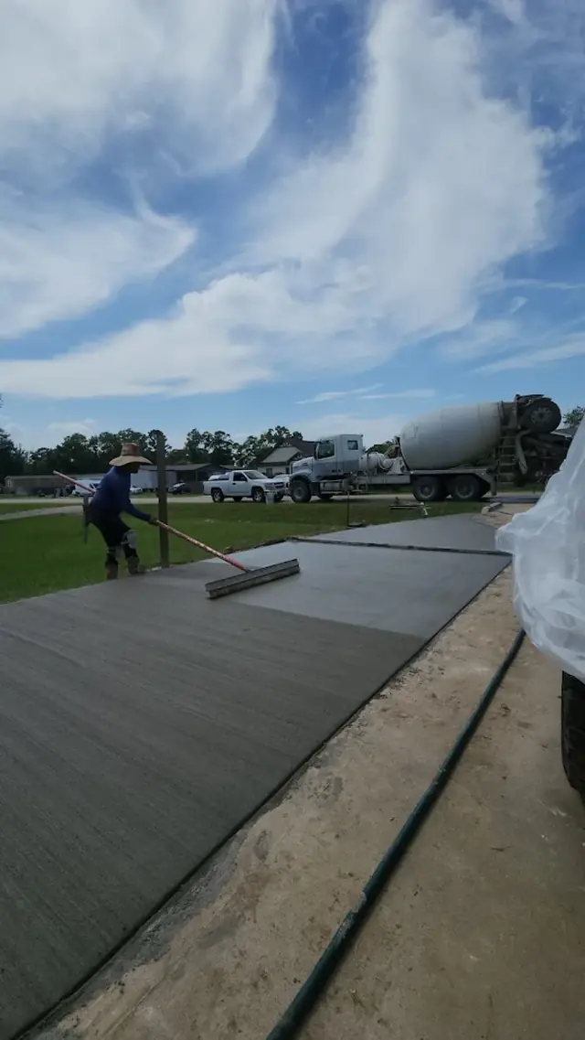 Freshly finished concrete slab being smoothed